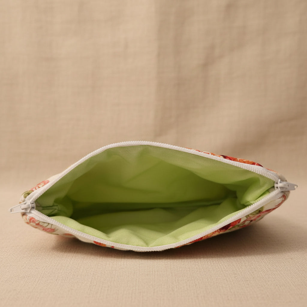 Open hibiscus floral hand-quilted pouch showing lime green interior lining