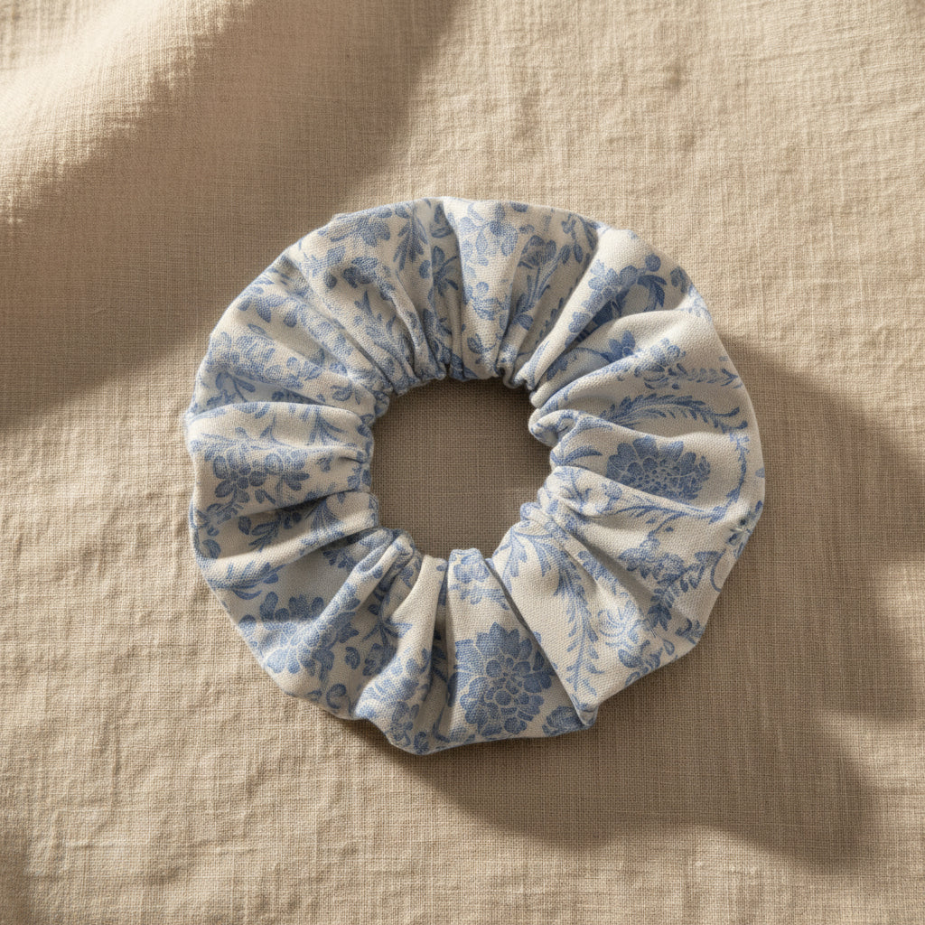 Top view of white light blue floral cotton hair scrunchie