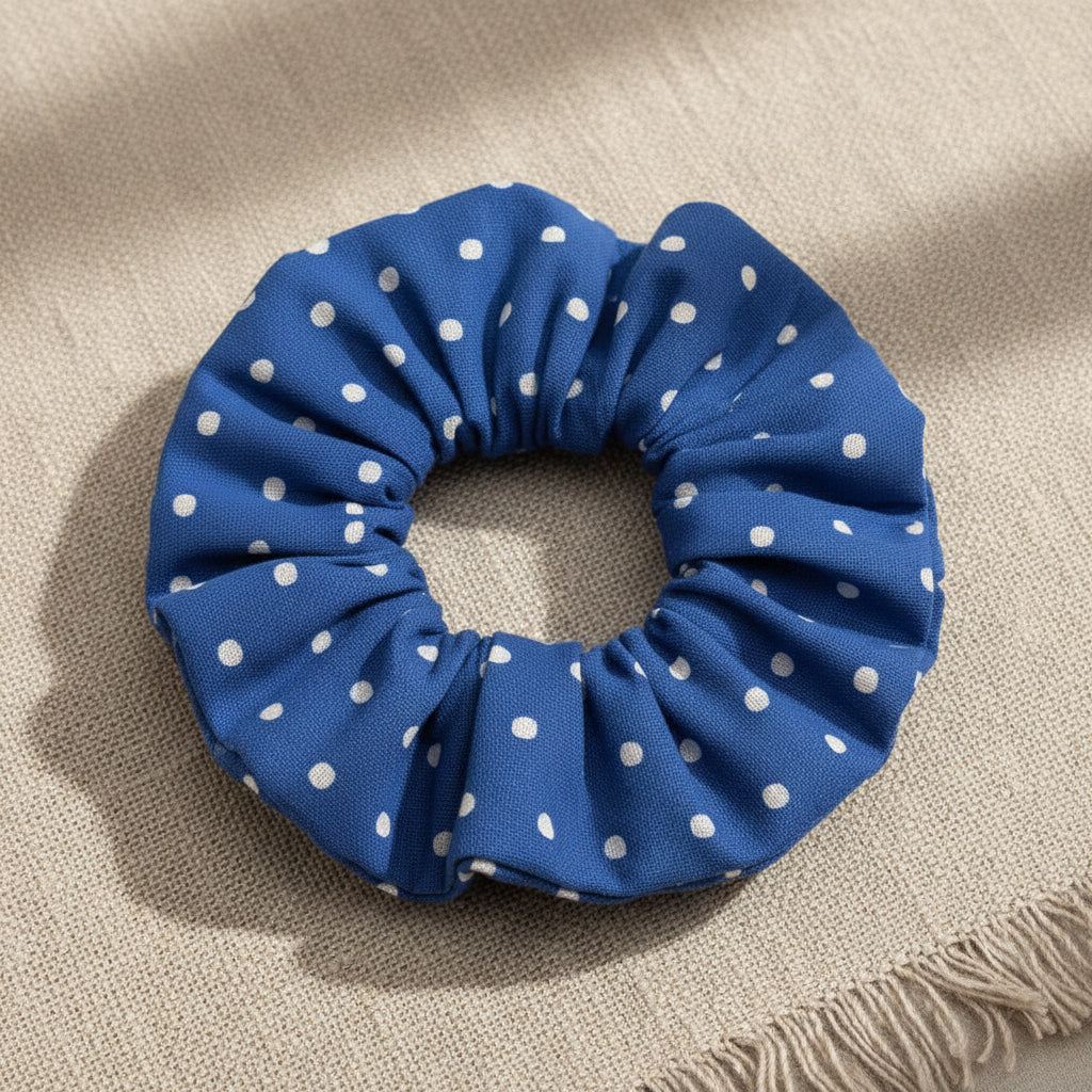 Dotty Blue handmade cotton scrunchie with white polka dots on beige fabric