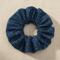Navy speckled dot handmade cotton scrunchie flat lay