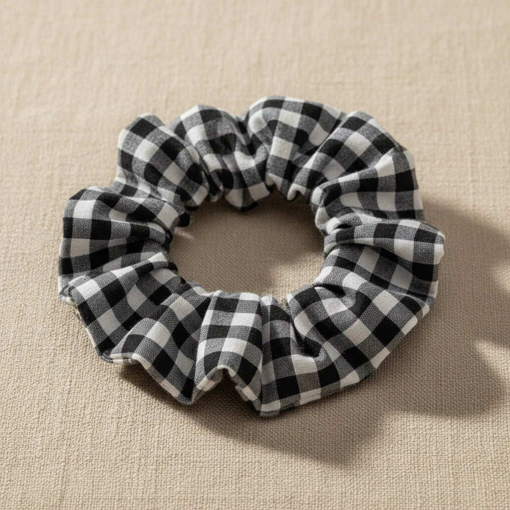 Close-up of black and white checkered hair tie texture