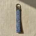 Blue daisy print cotton wristlet strap with antique brass hardware