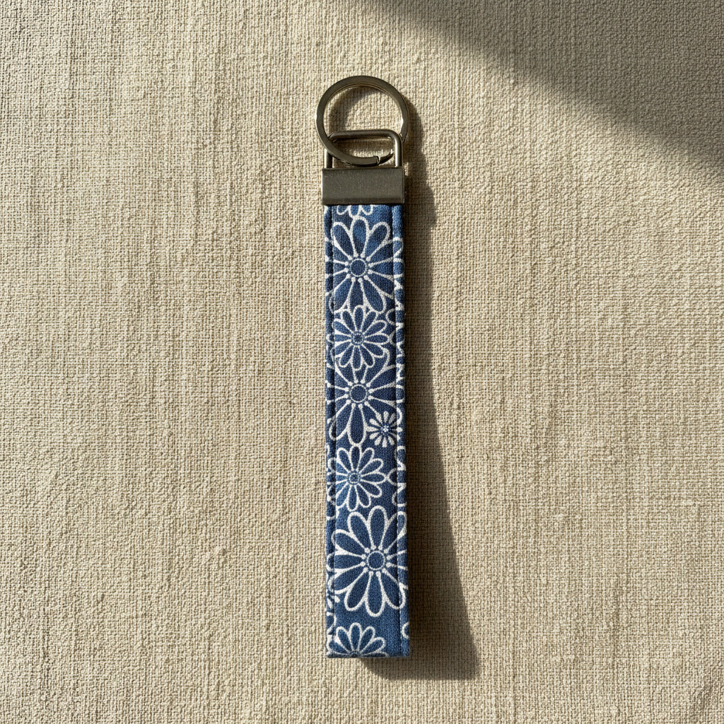 Blue daisy print cotton wristlet strap with antique brass hardware