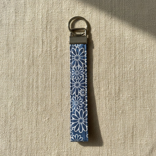 Blue daisy print cotton wristlet strap with antique brass hardware