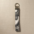 Gray and white floral cotton wristlet strap with silver split ring