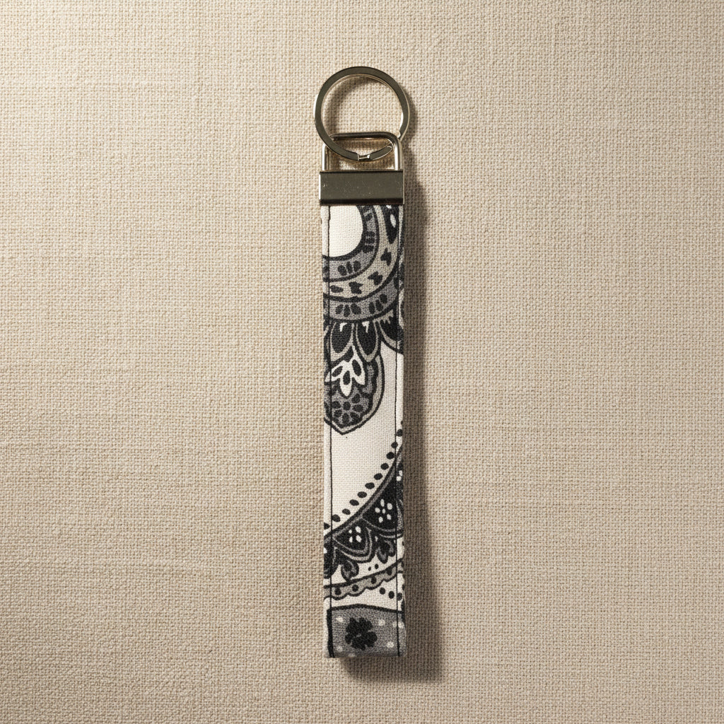 Gray and white floral cotton wristlet strap with silver split ring